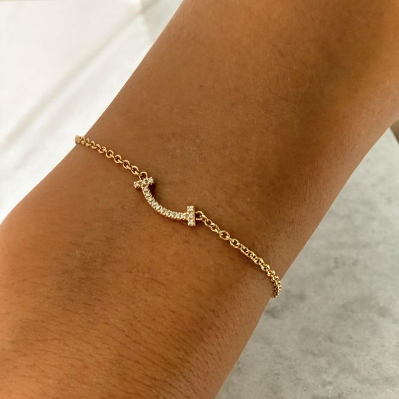 BRACELET TIFFANY  T SMILE OR 18CT ET DIAMANTS 1.64GR