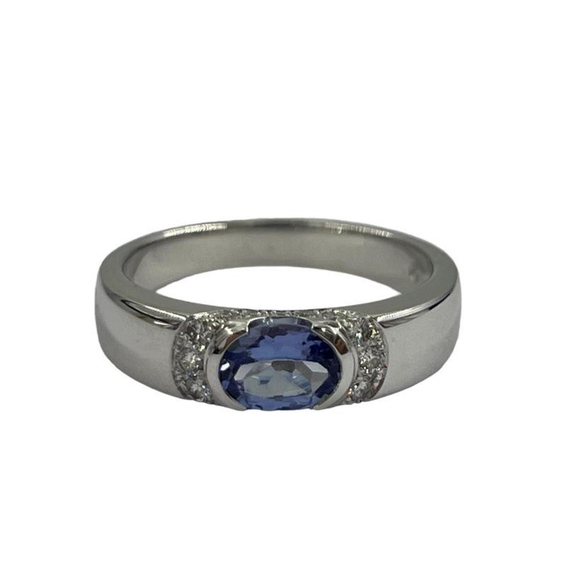 BAGUE OR BLANC 18CT  5.25GRS AVEC 1 TANZANITE OVALE 0.64 ET 16 DMTS 0.18CTS T.56